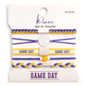 Set of hair tie and bracelets with 'Game Day' text on a branded card.