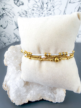 gold and white beaded bracelet stack set of three nikki smith waterproof lsu