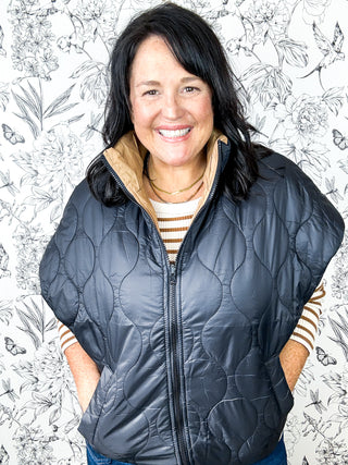 Harvest Layers Quilted Puffer Vest, Reversible Black Quilted with Tan interior, Euro sizing and fit, runs generous, oversized, relaxed silhouette, cap sleeves, mock collar, pockets on black side, elastic waist, EURO brand B. YOUNG