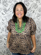 leopard split mock neck with green embroidered details ENTRO
