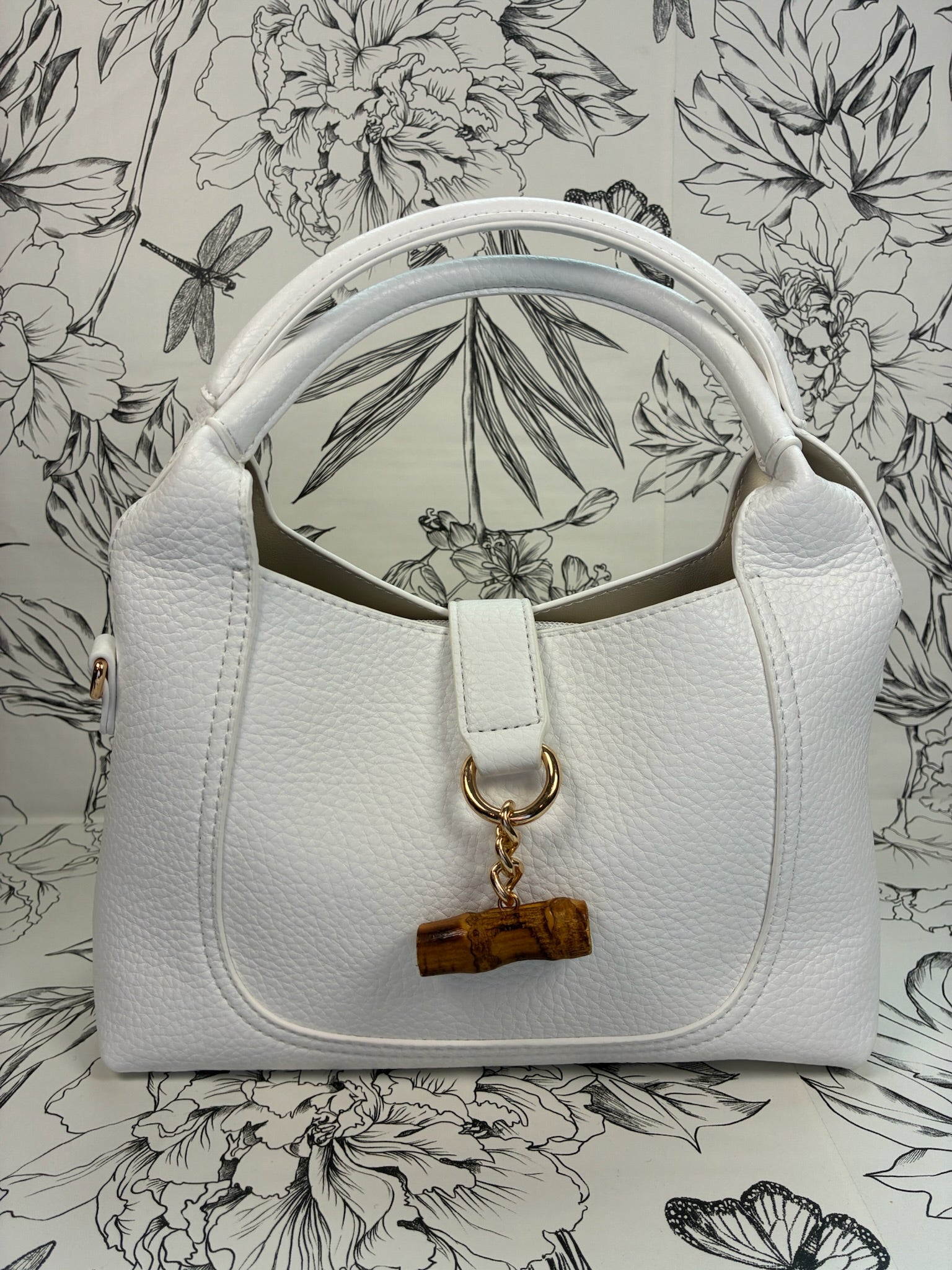 white satchel with bamboo closure