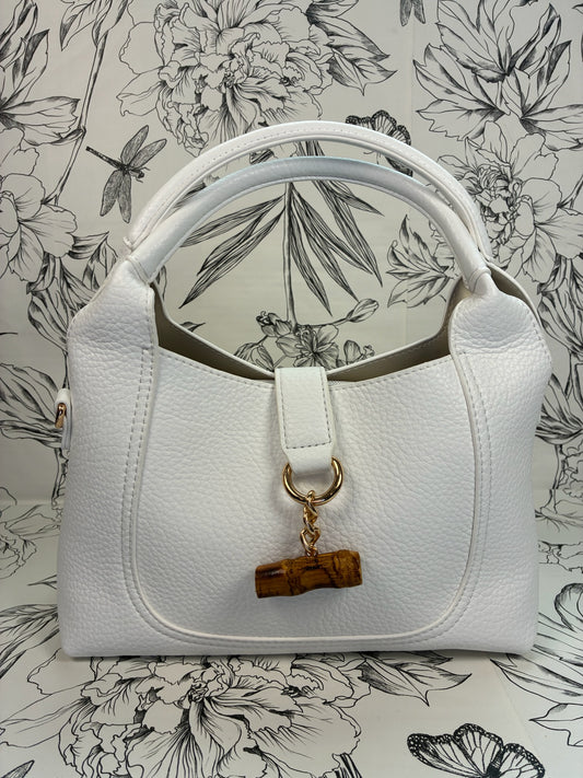 white satchel with bamboo closure