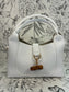 white satchel with bamboo closure