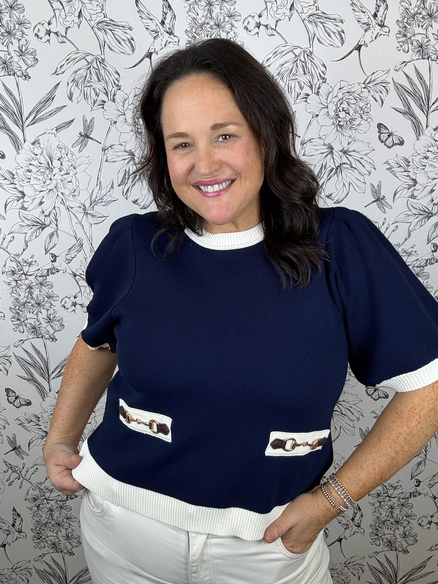 navy and white knit top with horsebit detail ENTRO