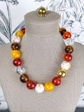 pop of joy beaded necklace in maple, rust, yellow, brown, beads