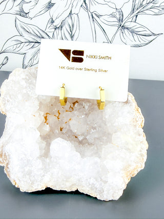 Small 14K gold over sterling silver hexagon huggie hoops by Nikki Smith Jewelry.