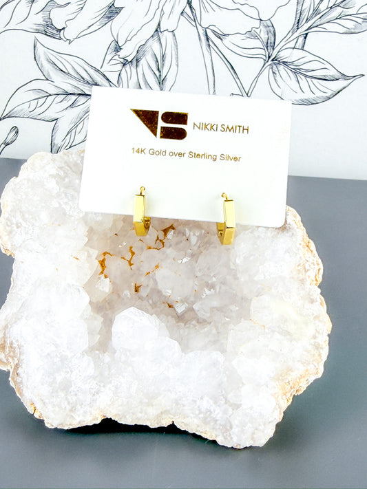 Small 14K gold over sterling silver hexagon huggie hoops by Nikki Smith Jewelry.